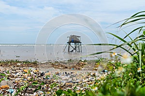 Wide shot of Vietnamese coastline covered in trash and garbage photo