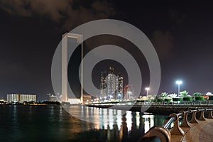 Beautiful view of Abu Dhabi city from the corniche beach, famous towers and landmarks | Etihad towers and Nations tower at night