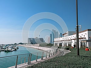 Beautiful view of Abu Dhabi city - Etihad towers and famous landmarks, Marina boats