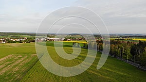 Beautiful view of an agricultural area in Central Europe, with green meadows and fields with crops, shot at a golden hour with