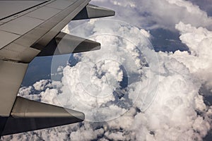 Beautiful view from the airplane window during flight of the sky with white clouds