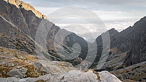 Beautiful view on alpine valley with big mountains and low clouds behind, Slovakia, Europe