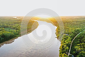 Beautiful view of an Amazon river between the jungles covered with sunlight