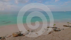 Beautiful view of Atlantic ocean coast with calm waves rolling on sandy coast.