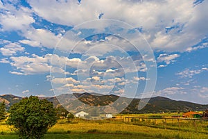 A beautiful view in autumn fields at the foot of a mountain range ion the outskirts of Bozeman, Montana photo