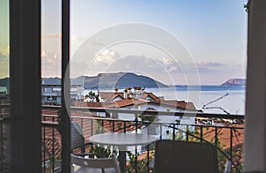 Beautiful view from balcony of red roofs and sea in Kas town on Mediterranean coast, Turkey