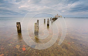 Beautiful view on Baltic sandy coast with old military buildings