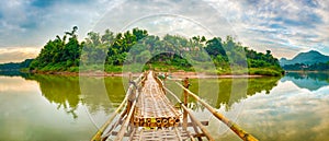 Beautiful view of a bamboo bridge. Laos landscape. Panorama