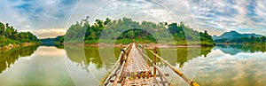 Beautiful view of a bamboo bridge. Laos landscape. Panorama
