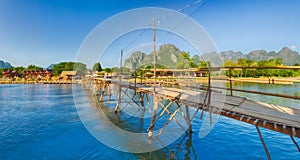 Beautiful view of a bamboo bridge. Laos landscape. Panorama