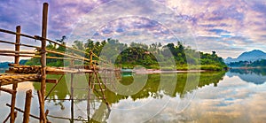 Beautiful view of a bamboo bridge. Laos landscape. Panorama