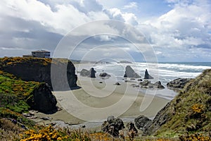 A beautiful view of Bandon beach in Bandon, Oregon, with the headlands and beautiful coast exposed at low tide for people to explo