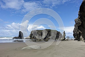 A beautiful view of Bandon beach in Bandon, Oregon, with the headlands and beautiful coast exposed at low tide for people to explo