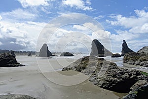 A beautiful view of Bandon beach in Bandon, Oregon, with the headlands and beautiful coast exposed at low tide for people to explo