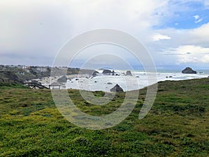 A beautiful view of Bandon beach in Bandon, Oregon, with the headlands and beautiful coast exposed at low tide for people to explo