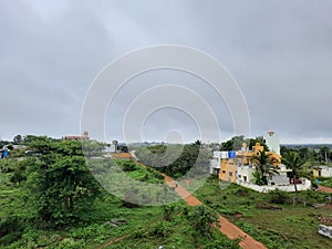 Beautiful view of Bangalore north village buildings and roads with nature background in a rainy season