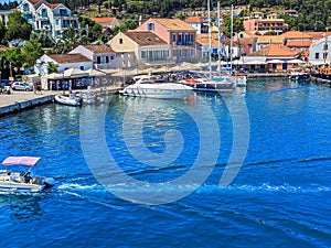 Beautiful view of the bay with boat and yacht and traditional house,