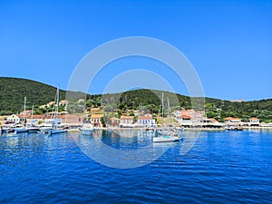 Beautiful view of the bay with boat and yacht and traditional house,