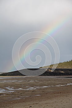 Beautiful view of a beach and a Rainbow in the sky in Vlissingen, The Netherlands