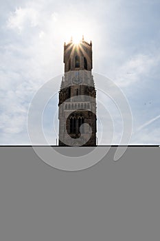 Beautiful view on the Belfry of Bruges - Backlight on the tower