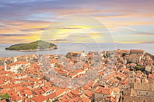 Beautiful view of the bell tower and the island Lokrum in the old town of Dubrovnik, Croatia