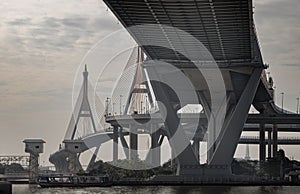 Beautiful view of Bhumibol suspension bridge cross over Chao Phraya River at afternoon