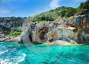 Beautiful view on Blue caves and blue water of Ionian sea on Island Zakynthos in Greece and sightseeing points on the rock. Boat t