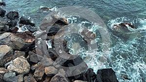 Beautiful view on blue ocean. Deep Blue Sea With Waves Crashing And Frothing Against Rocks