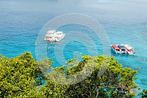 Beautiful view with blue sea and speed boats on Similan island, Similan No.8 at Similan national park, Phuket, Thailand