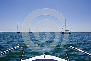 Beautiful view from a bow of yacht at seaward with yachts.Copy s