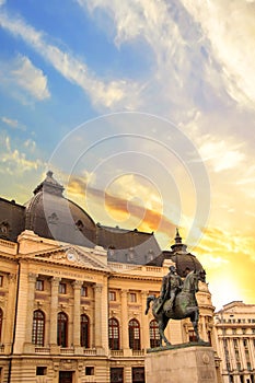 Beautiful view of the building of the Central University Library with equestrian monument to King Karol I in Bucharest, Romania