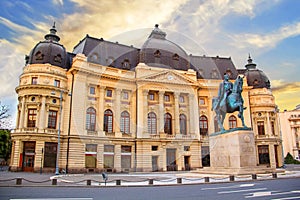 Beautiful view of the building of the Central University Library with equestrian monument to King Karol I in Bucharest, Romania