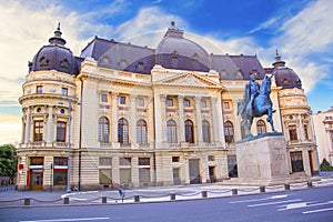 Beautiful view of the building of the Central University Library with equestrian monument to King Karol I in Bucharest, Romania