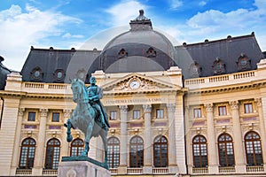 Beautiful view of the building of the Central University Library with equestrian monument to King Karol I in Bucharest, Romania