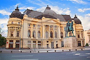 Beautiful view of the building of the Central University Library with equestrian monument to King Karol I in Bucharest, Romania