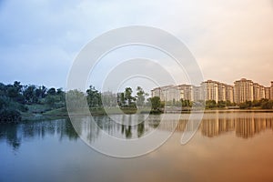 Beautiful view with buildings reflecting on the lake which near hometown