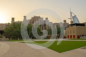 Beautiful view of Burj Al Arab and Souk Madinat Jumeirah Al Qasr luxury hotel during sunset