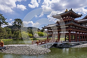Beautiful view of the Byodo-In temple in Uji, Kyoto, Japan and the access bridge