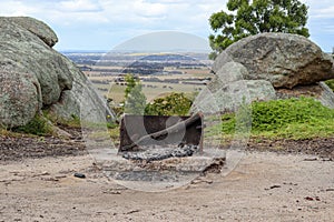 Beautiful view of a camp fire and rock formations at you yangs regional park