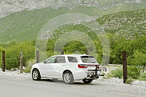 Beautiful view of car on roadside in mountains. Road trip