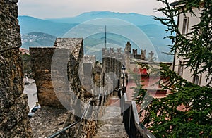 Beautiful view of Castel Brando from the top point with mountains in the background in San Marino