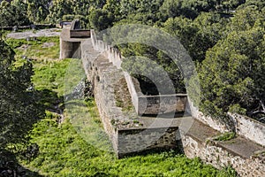 Beautiful view of the castle wall of Gibralfaro among green vegetation