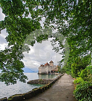 Beautiful view of Chateau de Chillon at Lake Geneva, one of Switzerland`s most visited castles in Europe, with sky full of cloud