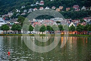 Beautiful view of the city of Bergen with a fountain in the evening