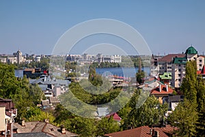 Beautiful view of the city from the observation deck. Little houses. River in the distance. Sunny day.