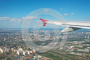 Beautiful view of the city when the plane takes off with the wing