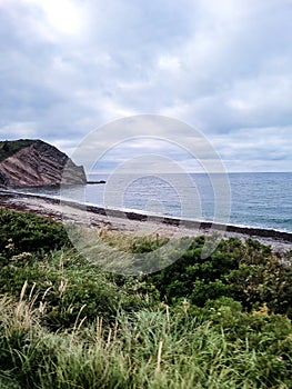 Beautiful view of the cliff and beach. Cape Breton, Canada.