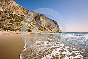 Beautiful view of a cliff on the shore of the sea in Kos island, Greece during sunset