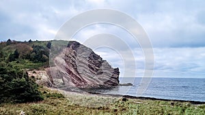 Beautiful view of the cliffs and beach. Cape Breton, Canada.