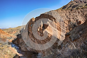 Beautiful view of cliffs from yellow red limestone. Kyrgyzstan